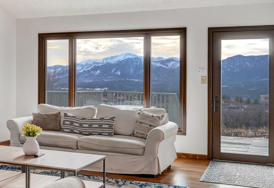 Living room with Pike's Peak views, walk out to deck with full front range views