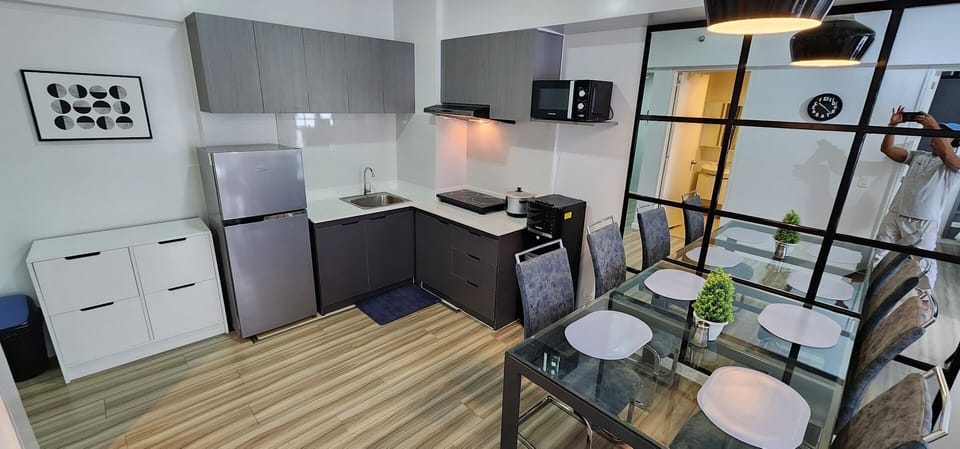 This spacious and stylish dining area seamlessly connects to the kitchen.