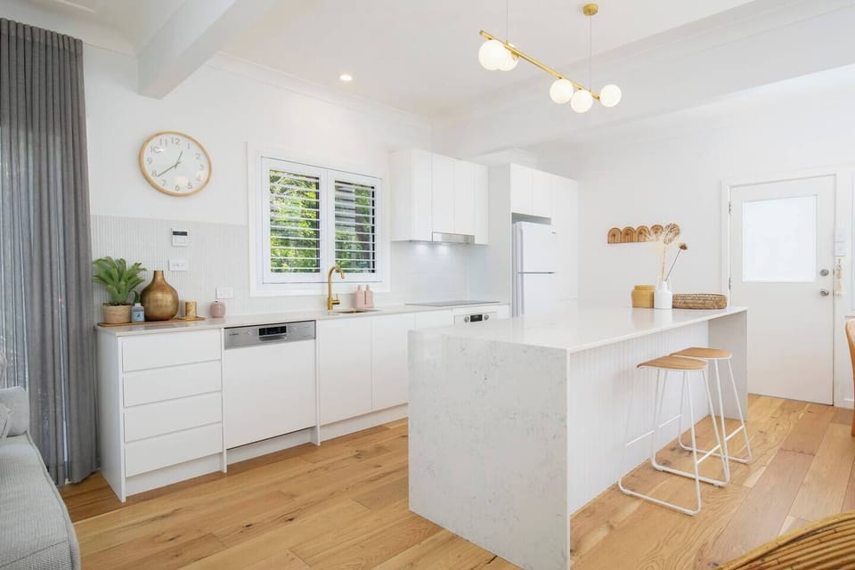 A stylish new kitchen comes equipped for all your holiday catering with a breakfast bar for slow mornings at home.