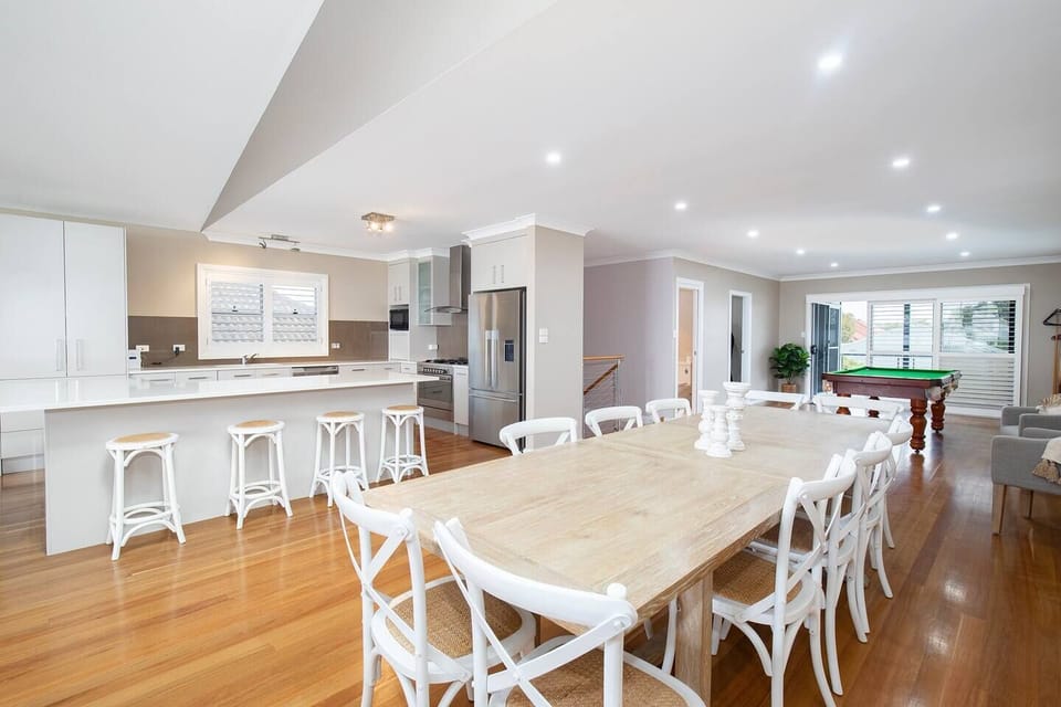 The grand central dining table makes it easy for guests to come together for a shared meal at home.
