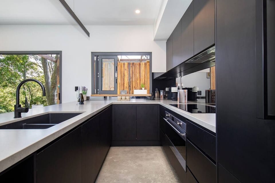  The gourmet kitchen comes fully equipped to prepare a meal at home with sleek new appliances and cooking utensils.
