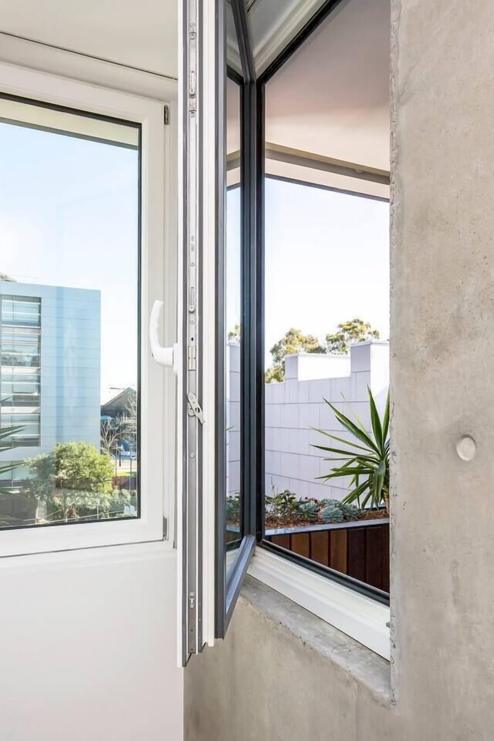The bedroom window opens up to your private balcony