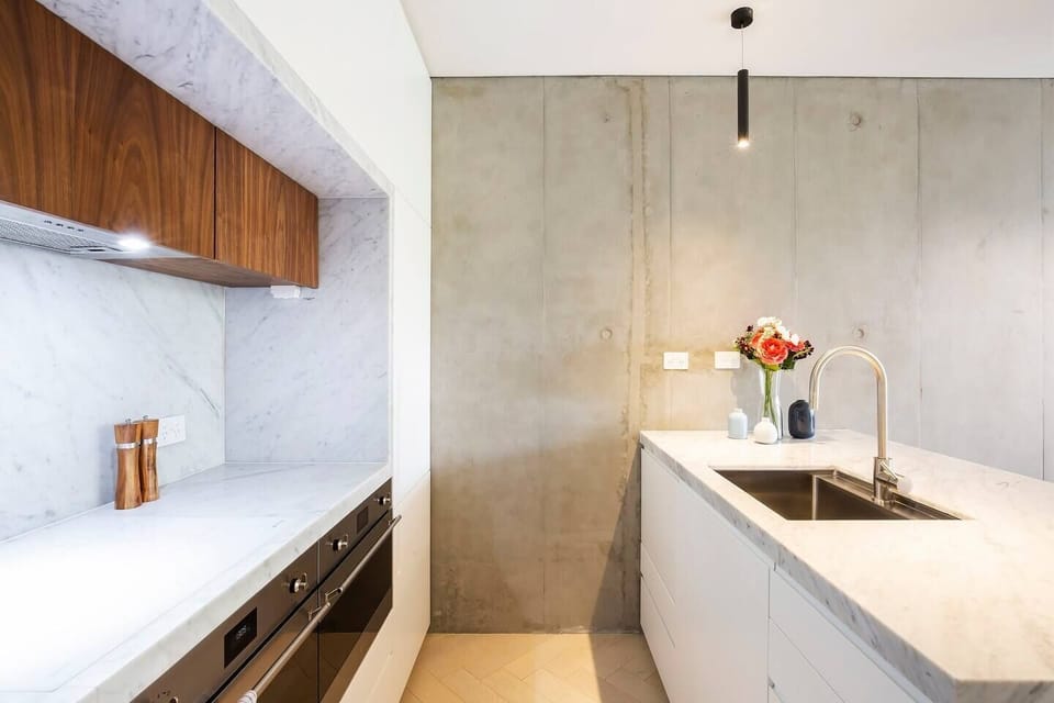 Homemade meals are made easy in the state-of-the-art entertainer's kitchen with Smeg oven, microwave/grill, and induction cooktop. 