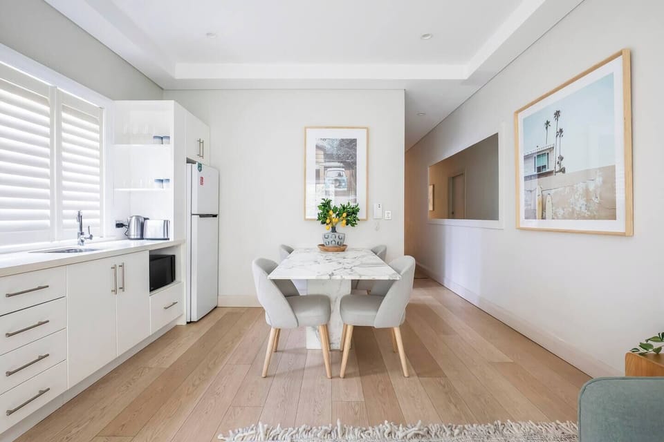Dine together at the four-seater solid Carrara marble dining table, with dimmed lighting to set the mood.