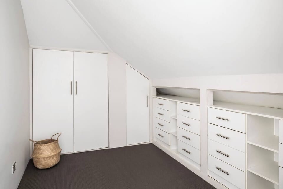 A spacious walk-in closet off the primary suite provides ample space to dress and store your belongings.