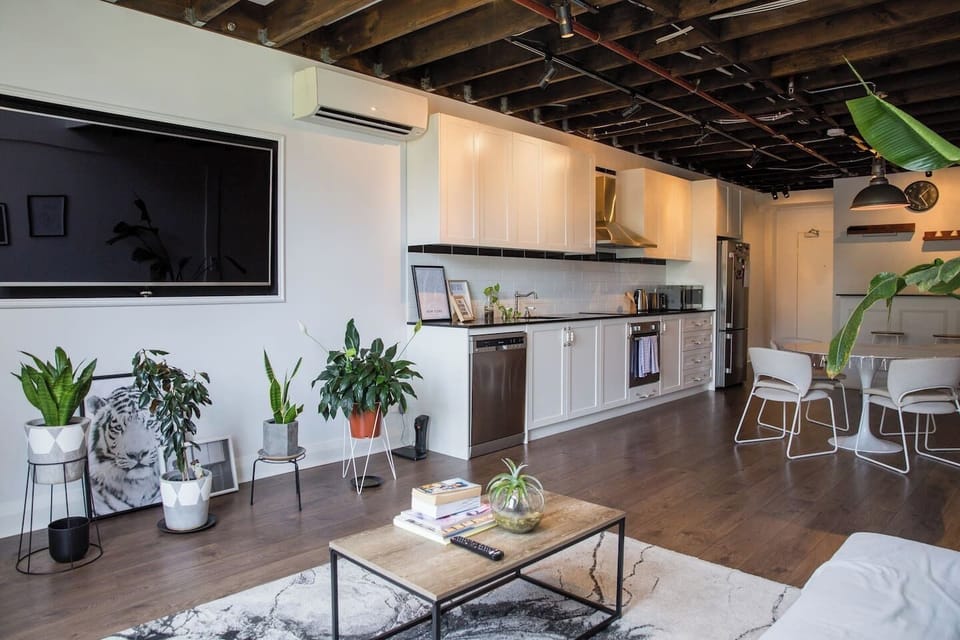 The designer kitchen includes a full size fridge/freezer, stove, oven, microwave, kettle, toaster, and more.