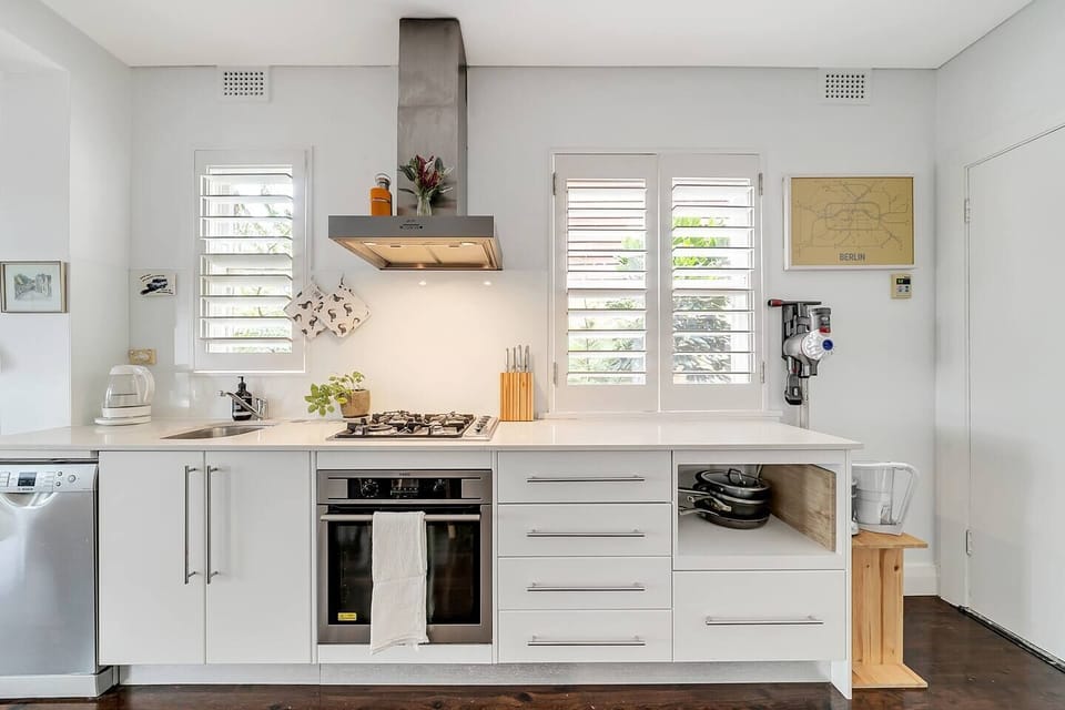 A fully-equipped kitchen has a stove, four-burner gas cooktop, dishwasher, full-sized fridge and all the cooking utensils you’ll need