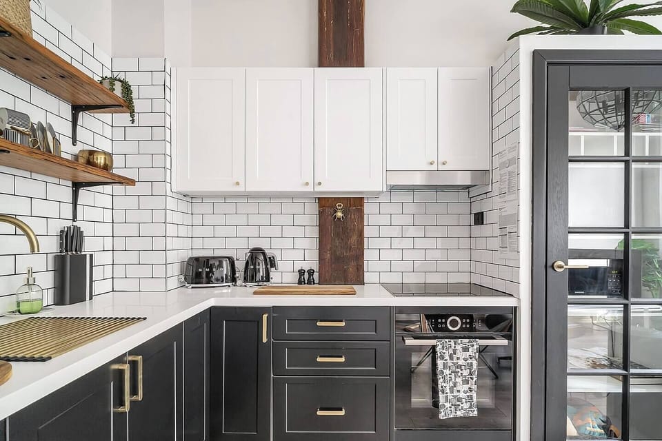 The stylish subway-clad kitchen makes it easy to prepare meals at home.
