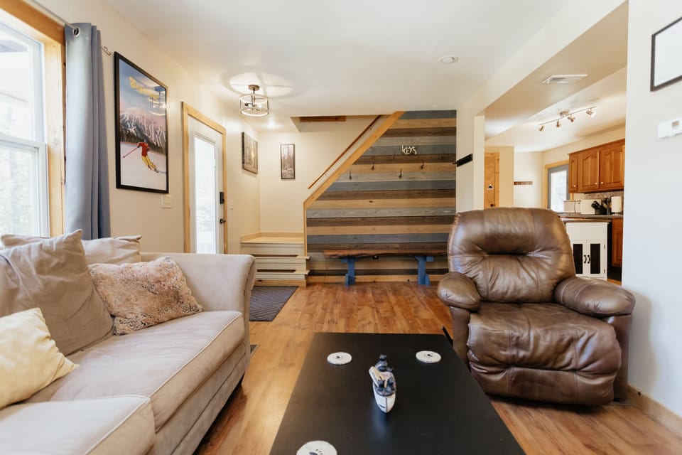 Bright living room with a sofa equipped with a full size pull out bed.
