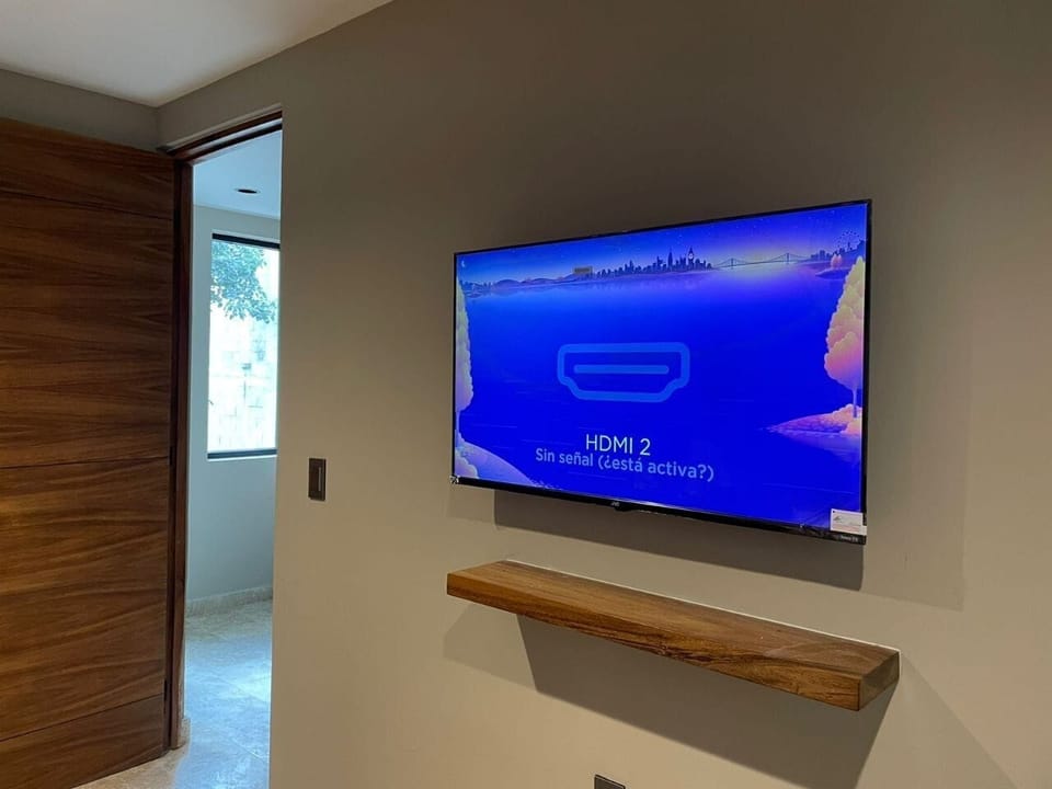 Flatscreen TV in 1st bedroom