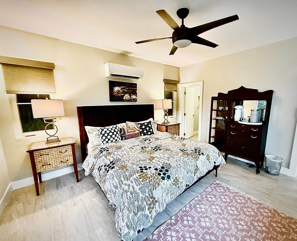 Suite with mini fridge, microwave, coffee makers, and limited kitchen supplies
