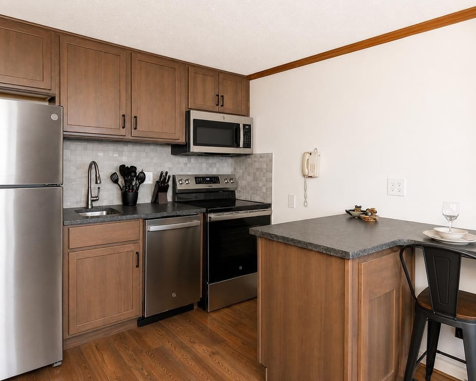 Prepare your favorite meals in the fully equipped kitchen featuring sleek stainless steel appliances.