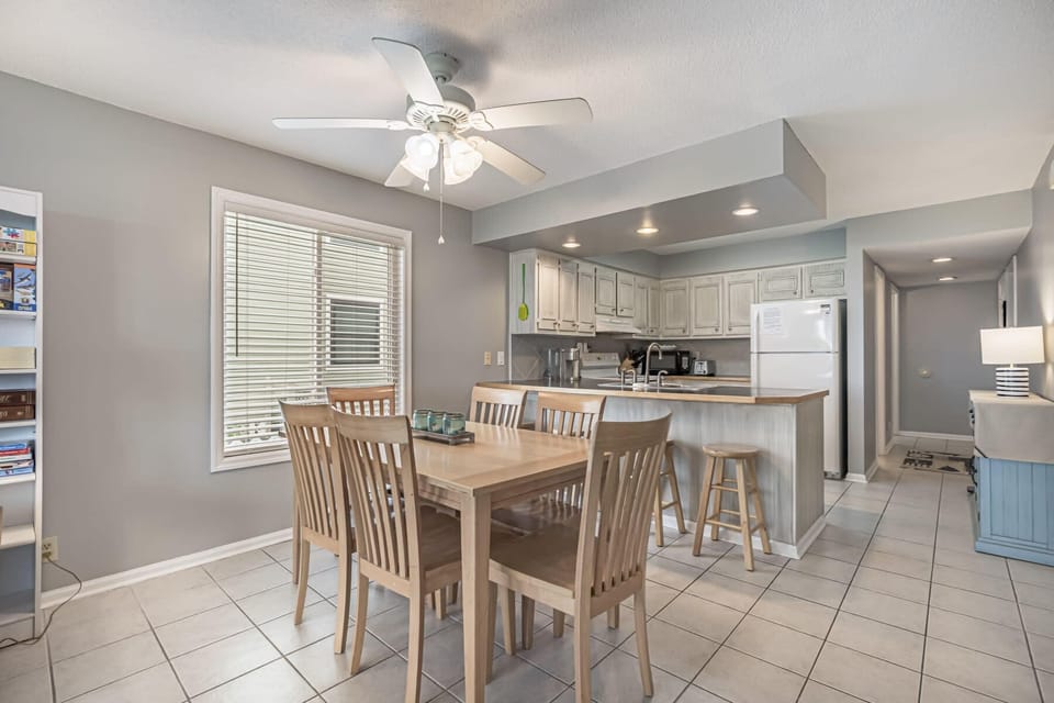 Dining table with seating for six + barstool seating for 4 (total seating: 10).