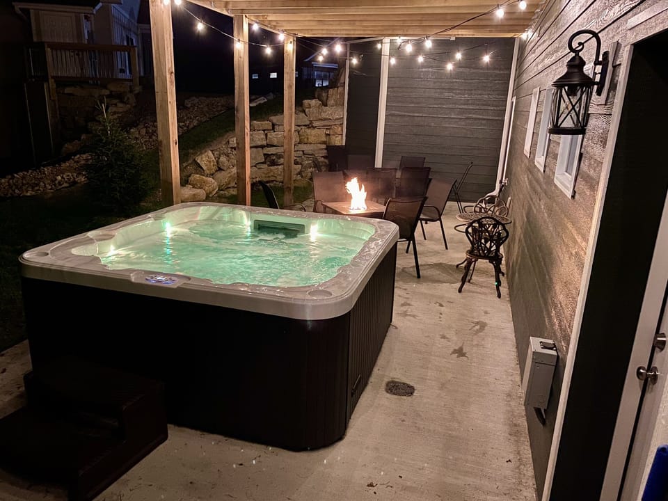 Enjoy your private 7 person hot tub near the propane fire pit & outdoor seating!