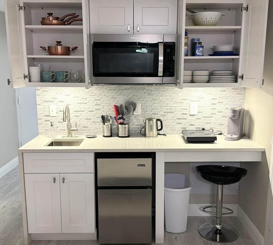 Sparkling quartz countertop kitchenette with breakfast bar & cooking essentials