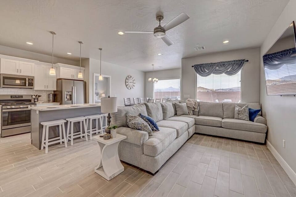 Large sectional couch for many people to be together with large smart tv.