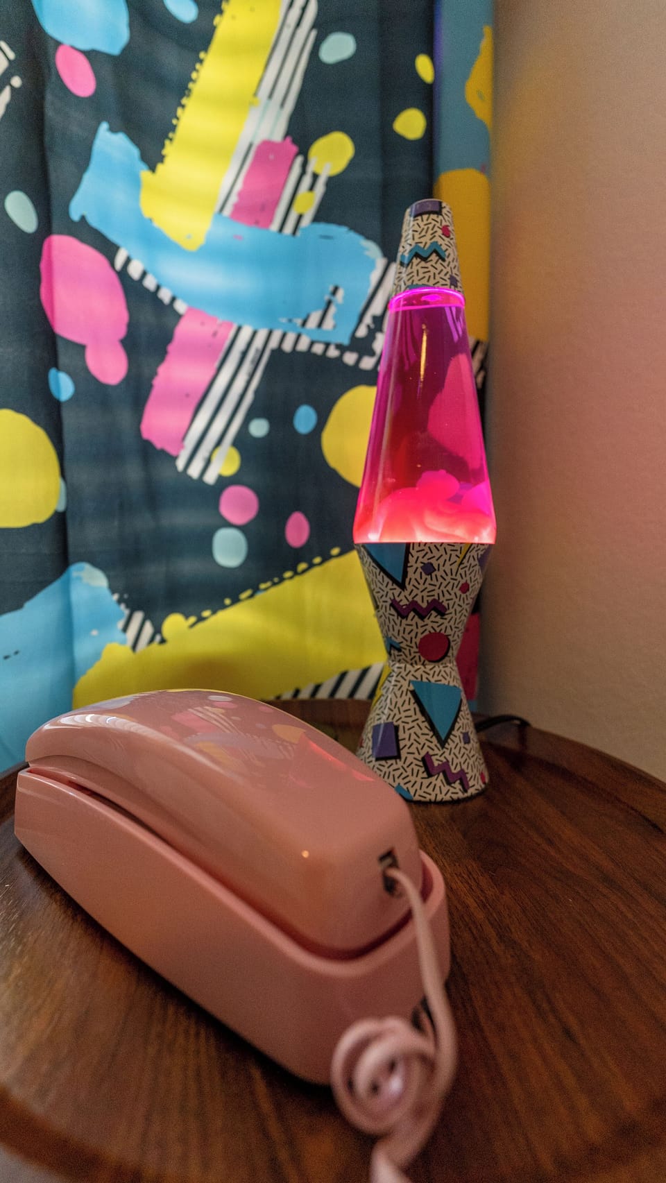 Throw it back with the retro setup of a classic lava lamp and corded phone!