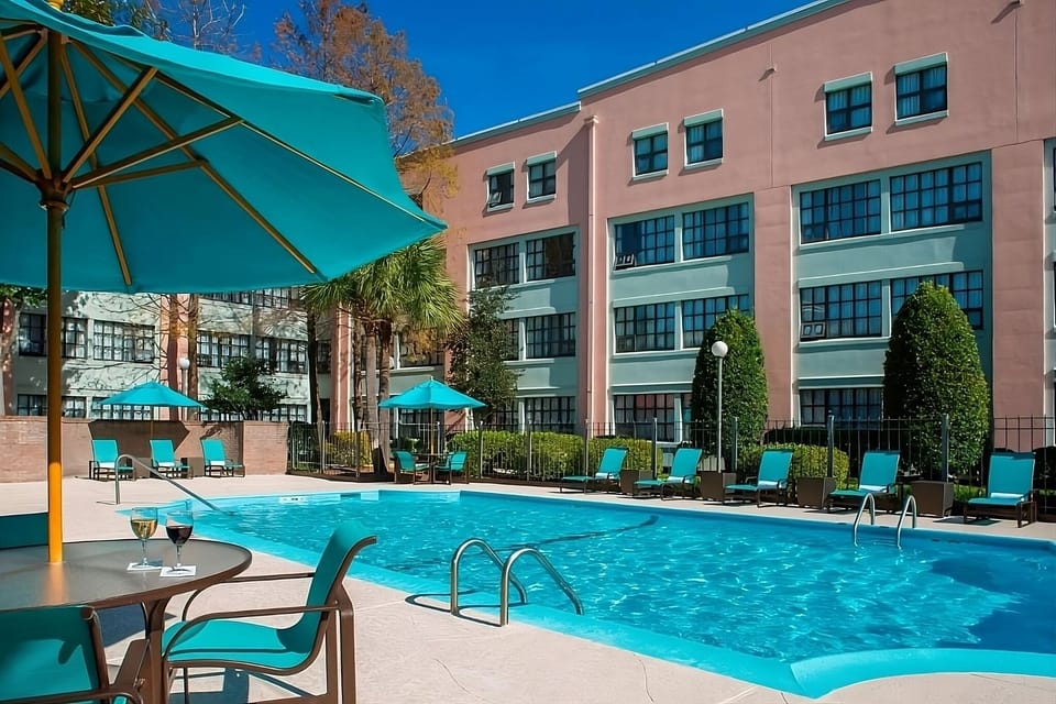 Dive into sunshine by the sparkling pool with loungers.