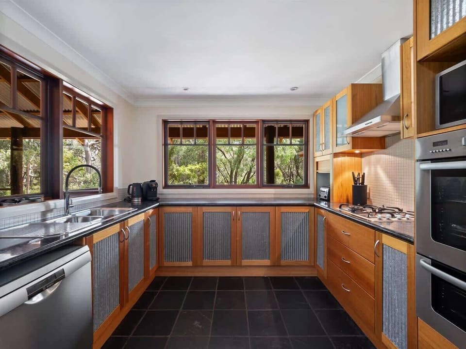 A fully equipped kitchen with modern appliances, a spacious breakfast bar, and everything you need to prepare delicious meals with ease.