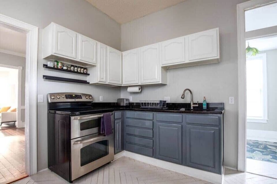 Kitchen with glass top stove and double ovens