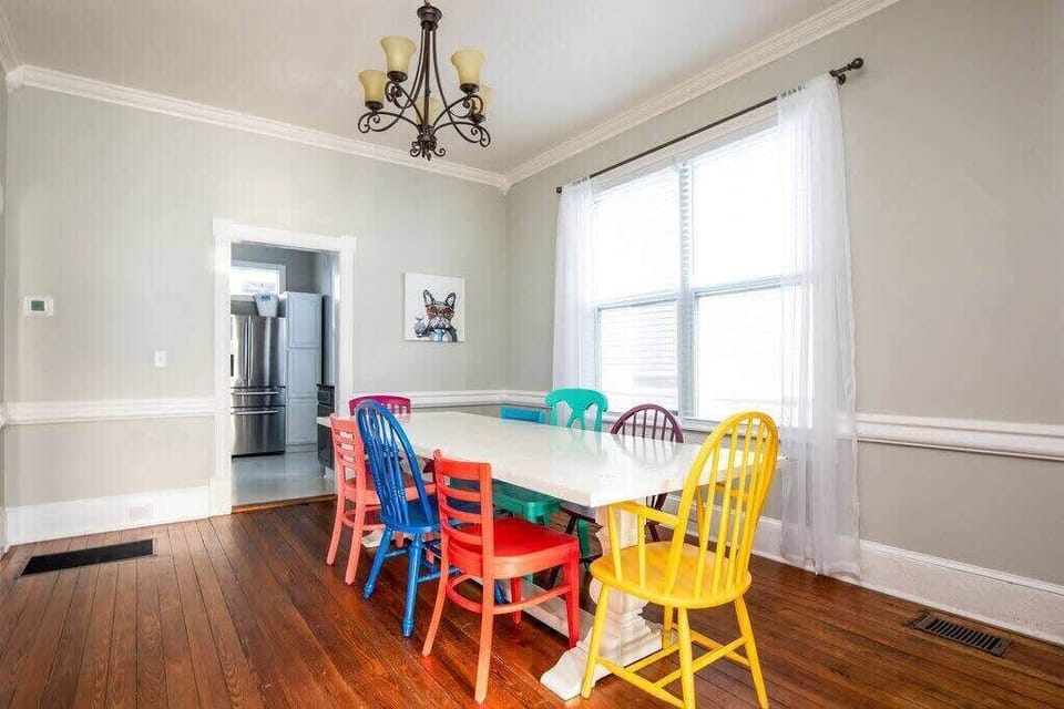 Colorful dining room with seating for everyone.