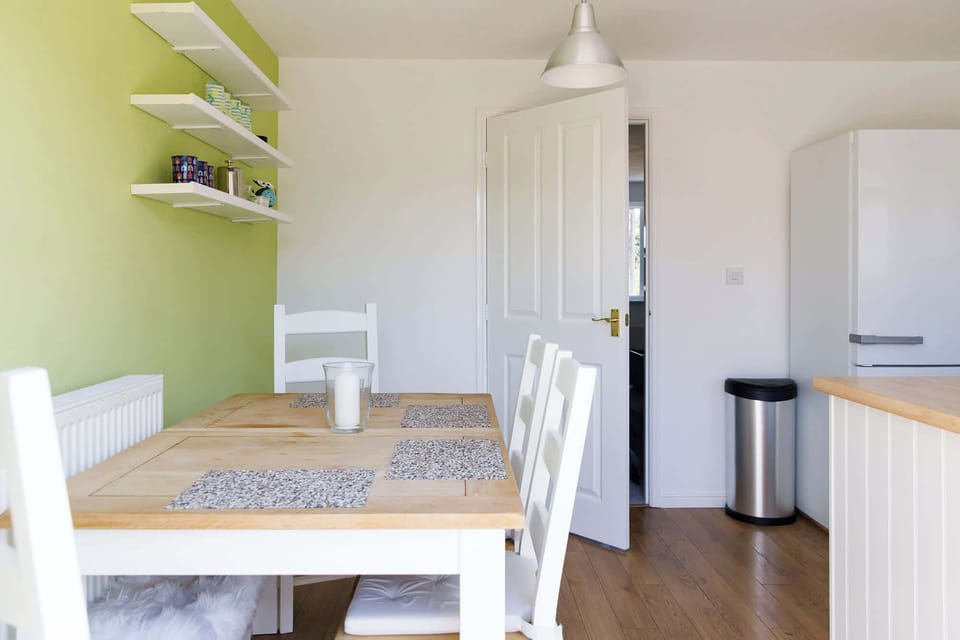 The kitchen has dining space with a table and chairs to seat up to 6 people.