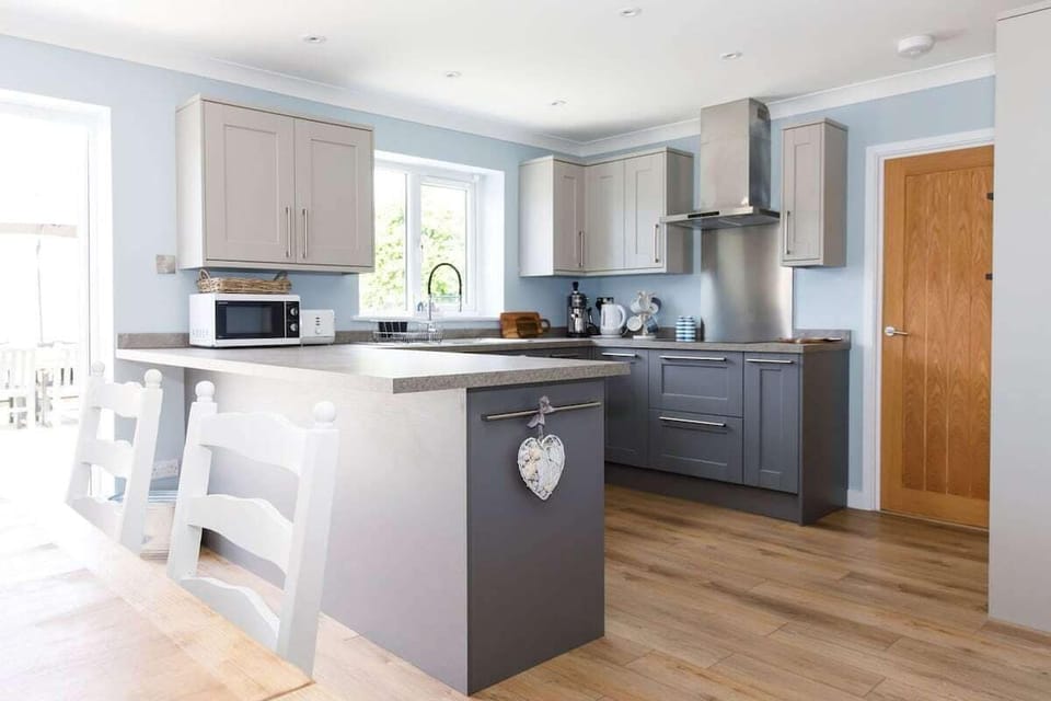 Prepare hearty meals in the L-shaped kitchen, thoughtfully designed and packed with modern appliances.