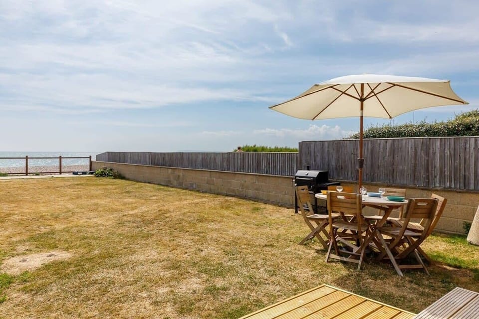 The garden has a BBQ, dining furniture and sun loungers. Enjoy uninterrupted sea views and dazzling sunsets from the comfort of your own garden.