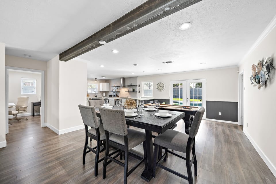 Spacious dining table that sits 6 with full tableware and silverware included.