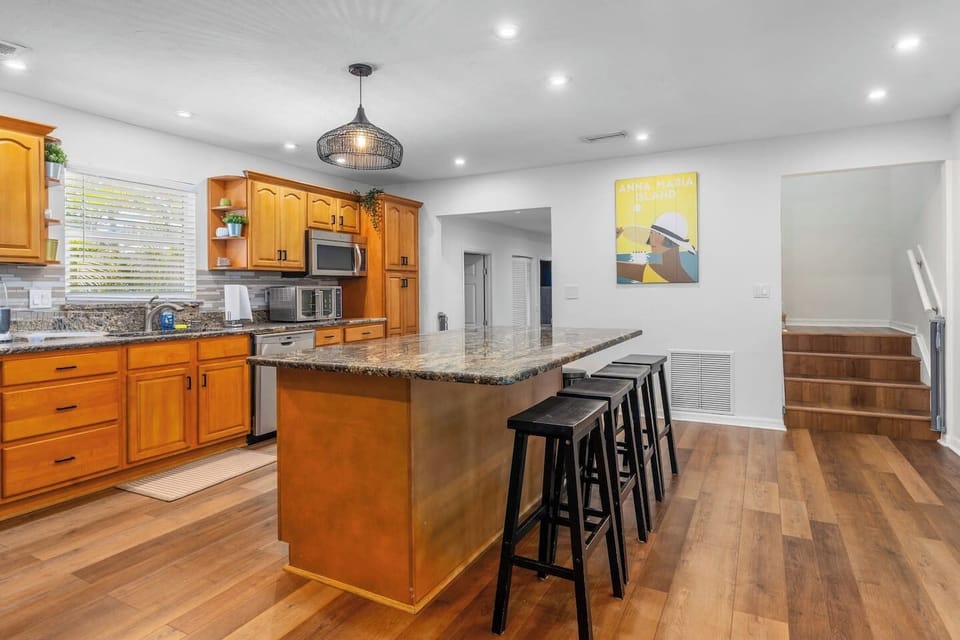 Gourmet Kitchen with Granite Counter Tops and Massive Island