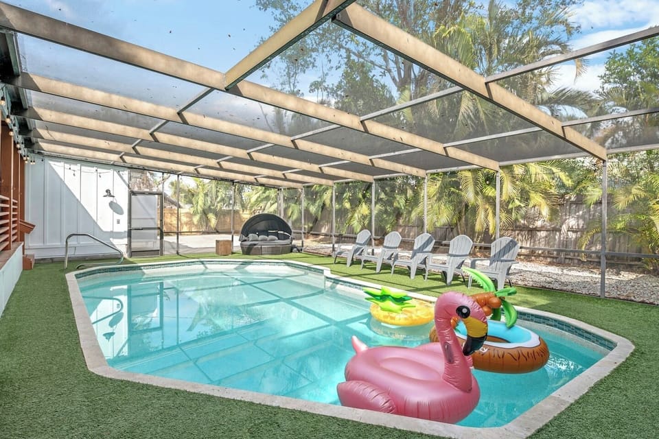 Screened Saltwater Pool with artificial non slip turf. Ping Pong, Bucket Ball, & Corn Hole.