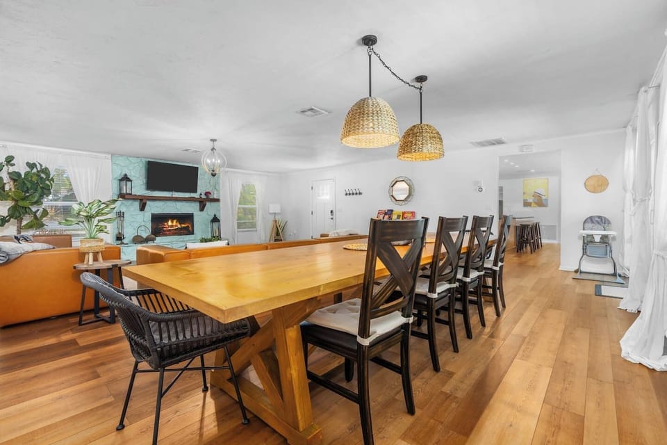 Newly decorated! Huge boho themed living room with 12-foot long custom dining table.