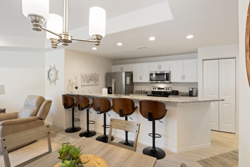 Modernly designed kitchen complete with amenities.
