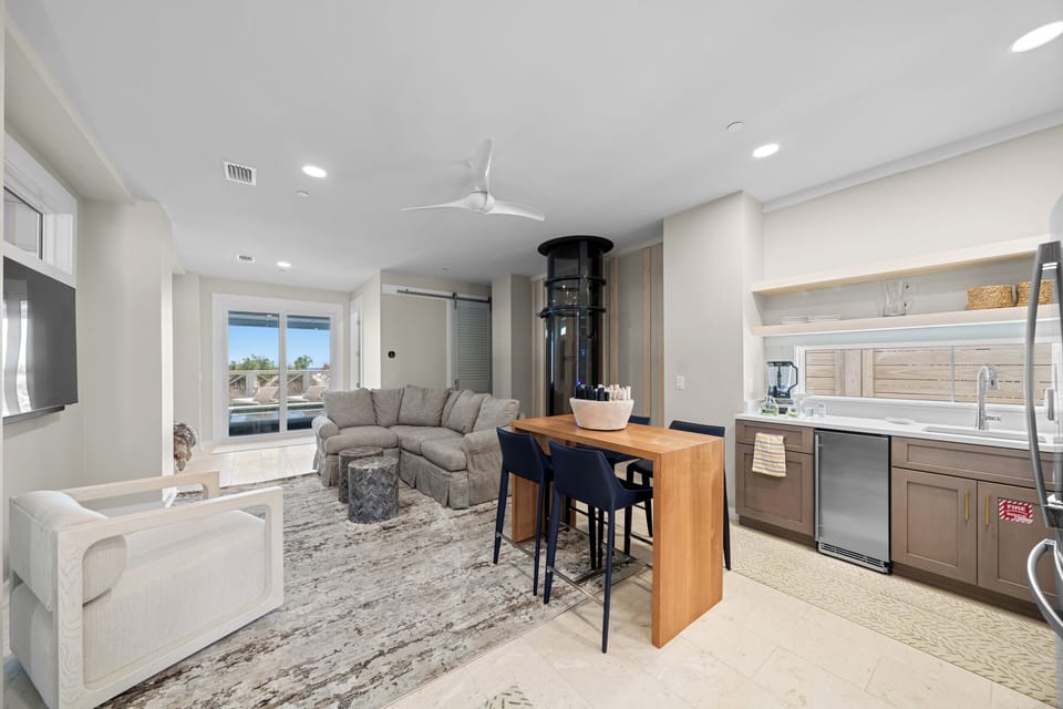 1st Floor Living Area with Kitchenette, Half Bath and Pool Access