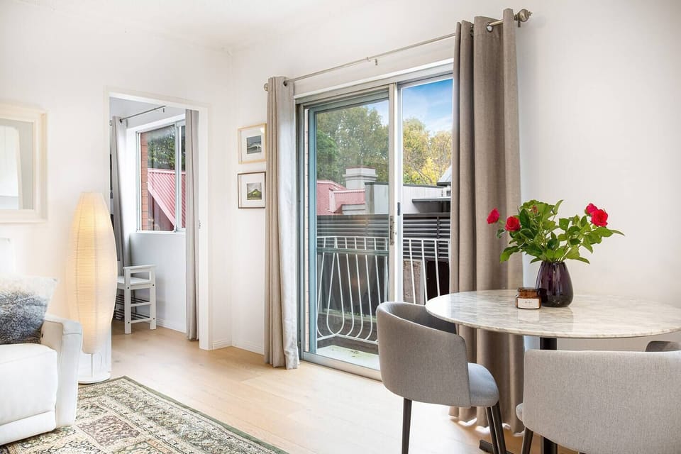 A small dining table makes it easy to enjoy a meal at home or use as a dedicated workspace for setting up a laptop.