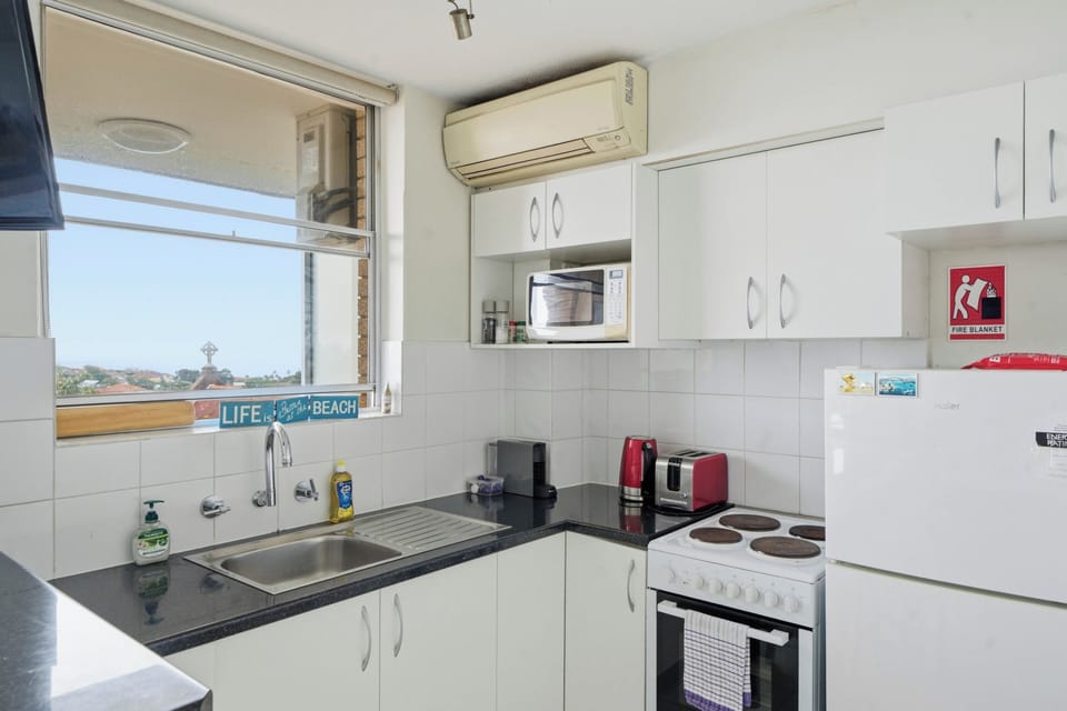 The compact kitchen has all the essentials you need to prepare meals at home.