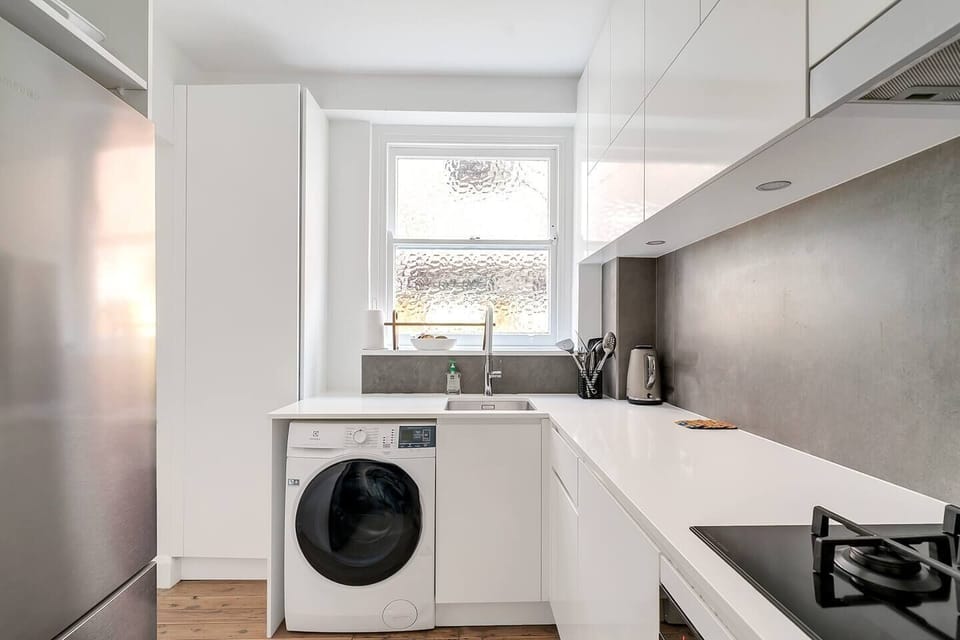 An internal washing machine and dryer within the kitchen adds to your everyday convenience.