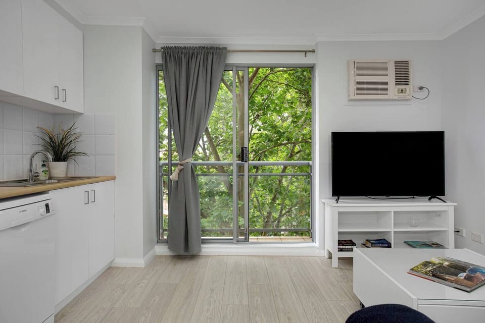 The living area flows straight to the balcony, creating a lovely transition with the outdoors.