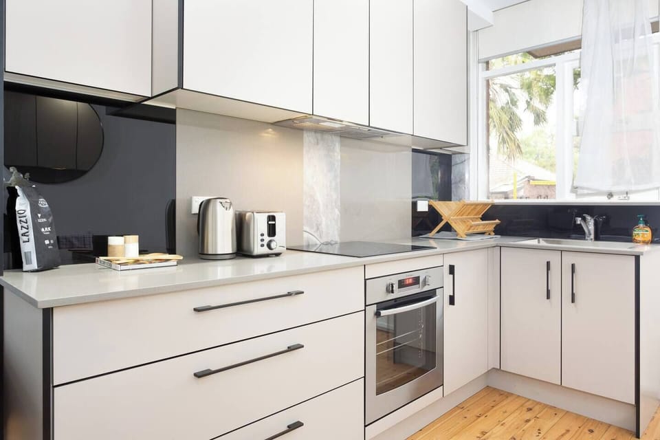 A fully-equipped kitchen is fit with high-end appliances including an oven, electric cooktop and full-sized fridge.