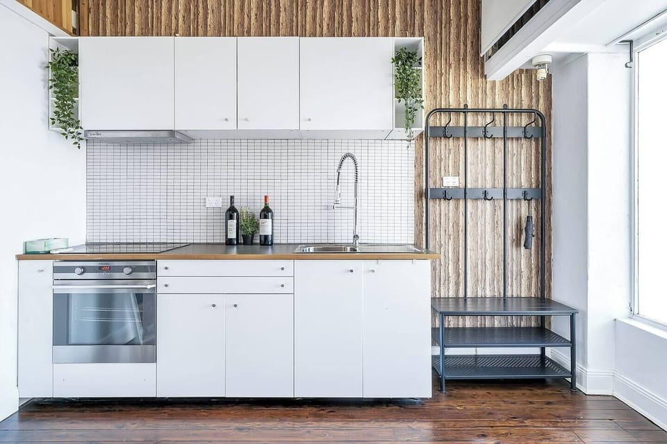 A kitchenette offers ample space to cook meals at home.
