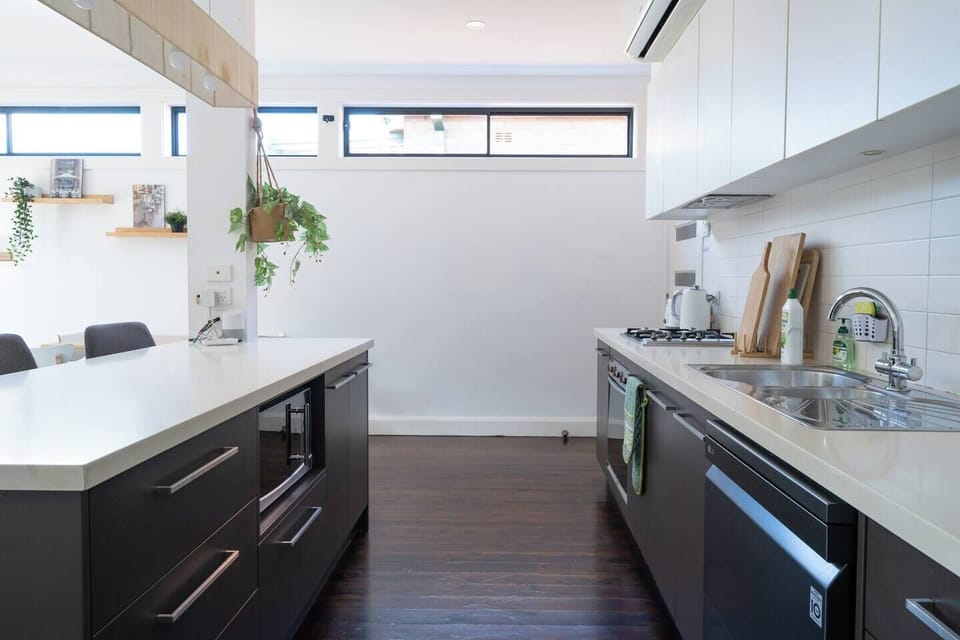  The full kitchen is designed around a breakfast bar and comes fully equipped to prepare meals at home.