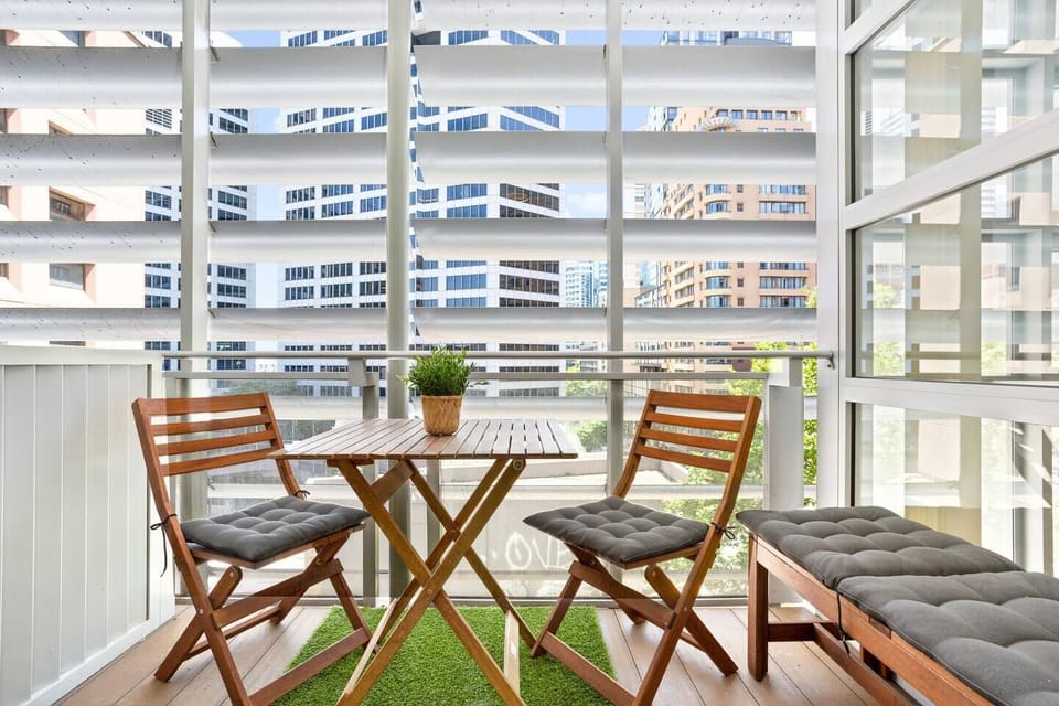 Enjoy an afternoon glass of wine on your furnished private balcony.
