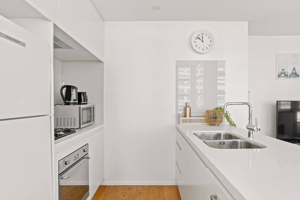 The modern, streamlined kitchen has all the essentials needed for guests to prepare meals at home. 
