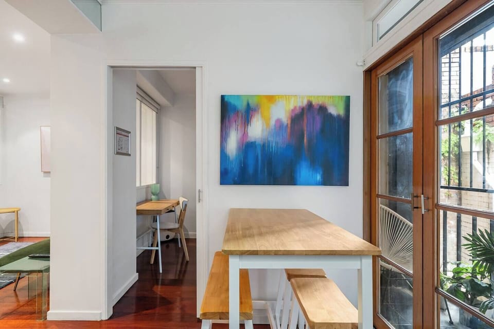 Bold pops of colour throughout the apartment create a unique and vibrant space and the perfect home away from home.