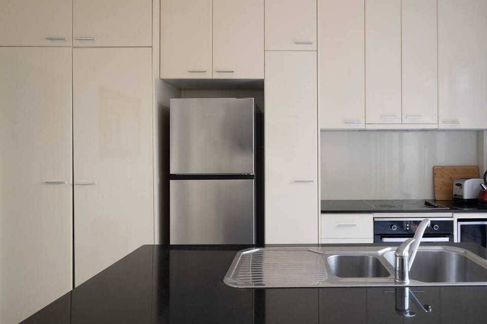 The kitchen comes fully equipped for meals at home with modern appliances and cooking utensils.
