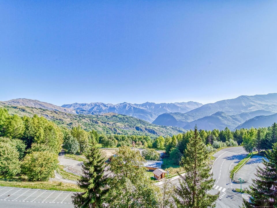 Sky, Building, Property, Table, Furniture, Cloud, Mountain, Interior Design, Outdoor Furniture, Wood
