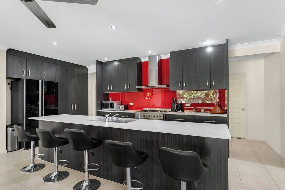 The spacious, open-plan kitchen has everything you need to cook up a feast at home.