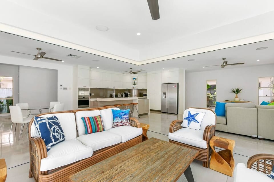 This spacious property encompasses indoor-outdoor living to truly reflect its tropical surrounds. 
