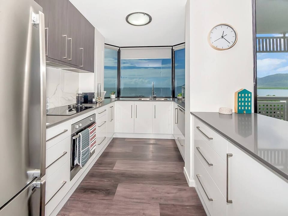 The generous kitchen is equipped for all your catering needs with modern stainless steel appliances and cooking utensils.