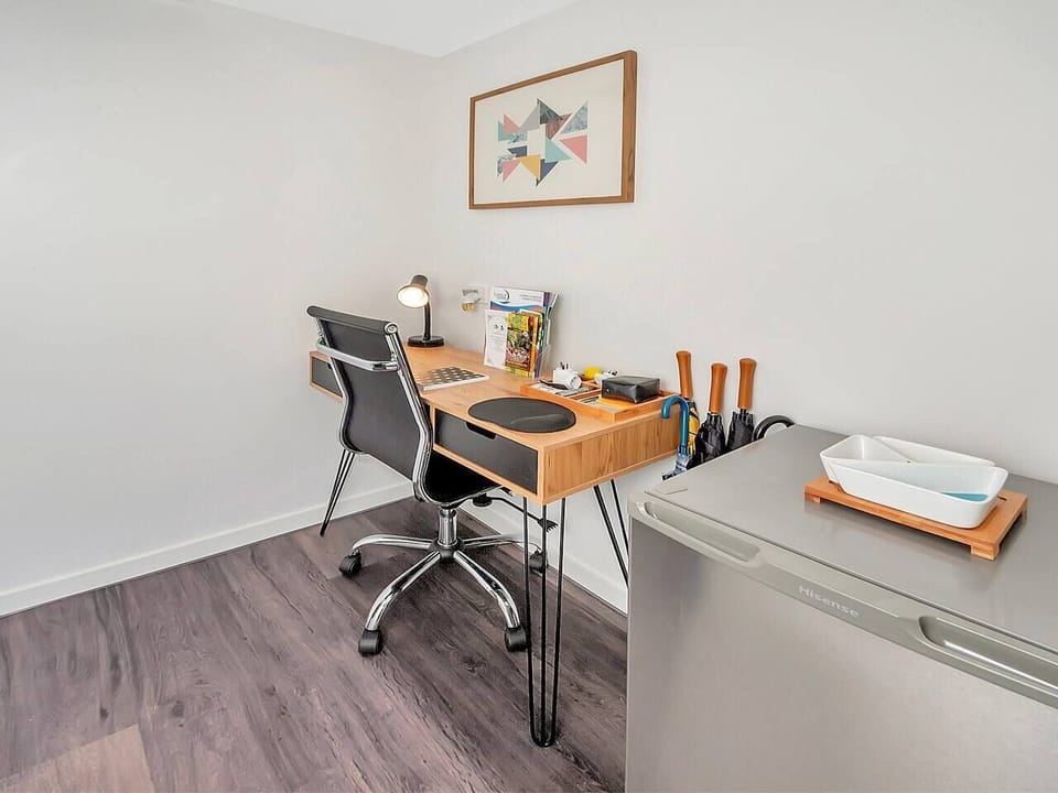 The apartment benefits from a dedicated workspace with free Wi-Fi throughout, ideal for those travelling on business or needing to catch up on emails.
